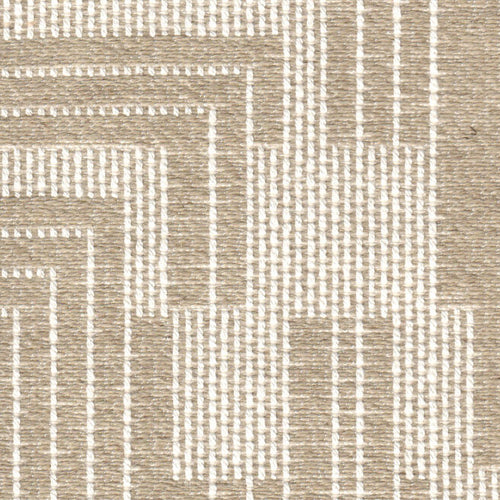 A close-up of a beige fabric with a geometric pattern, featuring a repeating geometric design.