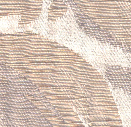 A textured fabric with a floral-like pattern in beige, gray, and white colors.